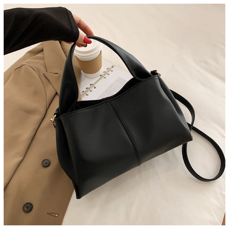 Medium Everyday Shoulder Bag in black leather, stylish and practical, perfect for casual or polished outfits.