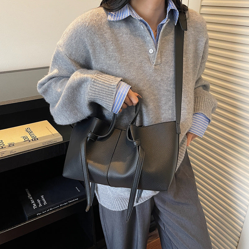 Black minimal crossbody bag for women with adjustable strap