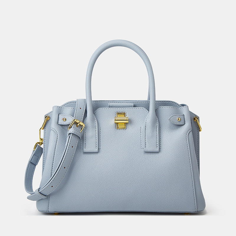 Blue medium top handle bag with structured shape and top handle design