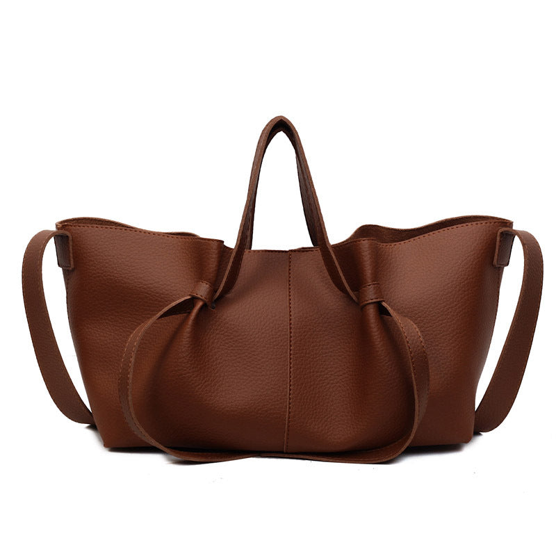 Soft Minimal Crossbody Bag in brown PU leather with elegant stitching and two straps.