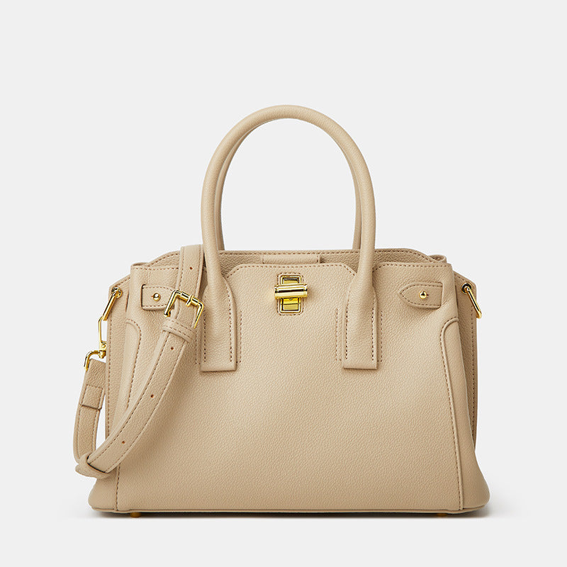 Khaki medium top handle bag with structured silhouette and gold lock detail