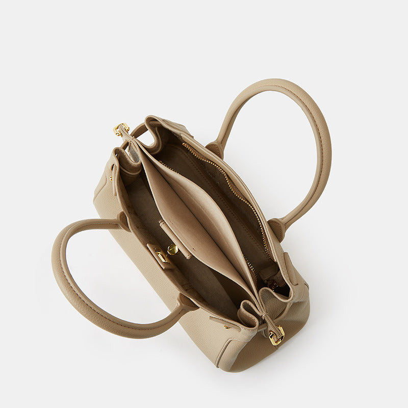 Side view of medium top handle bag in khaki